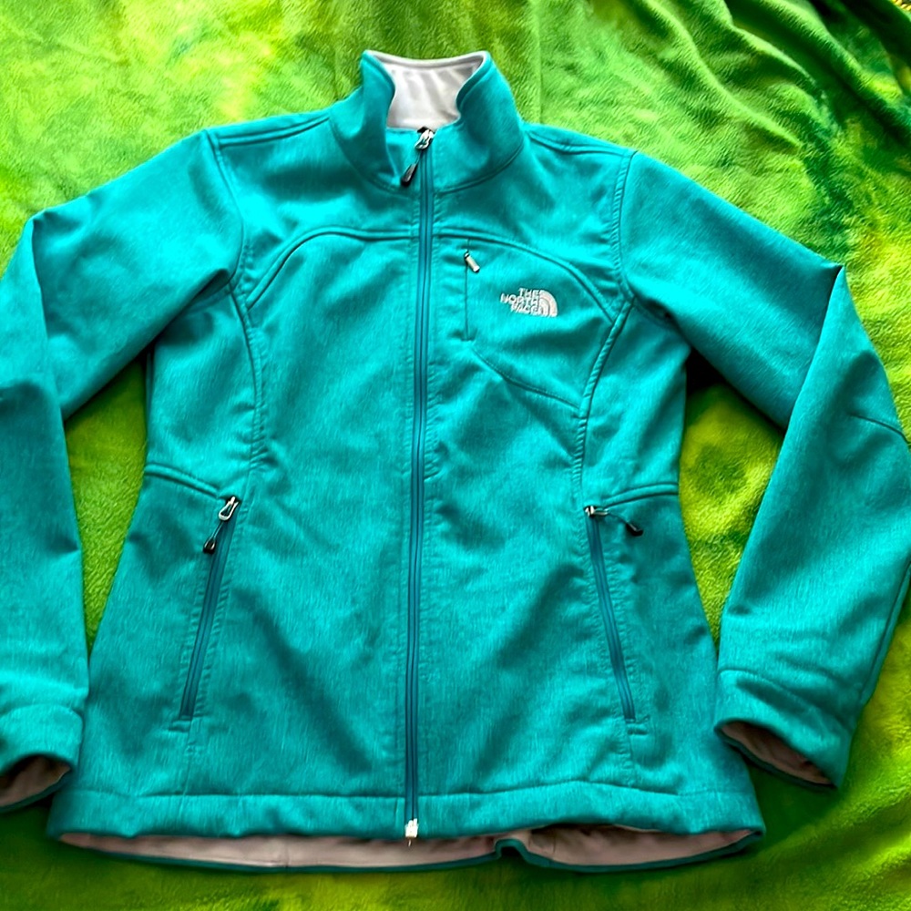 The North Face soft teal shell jacket, size small in women’s